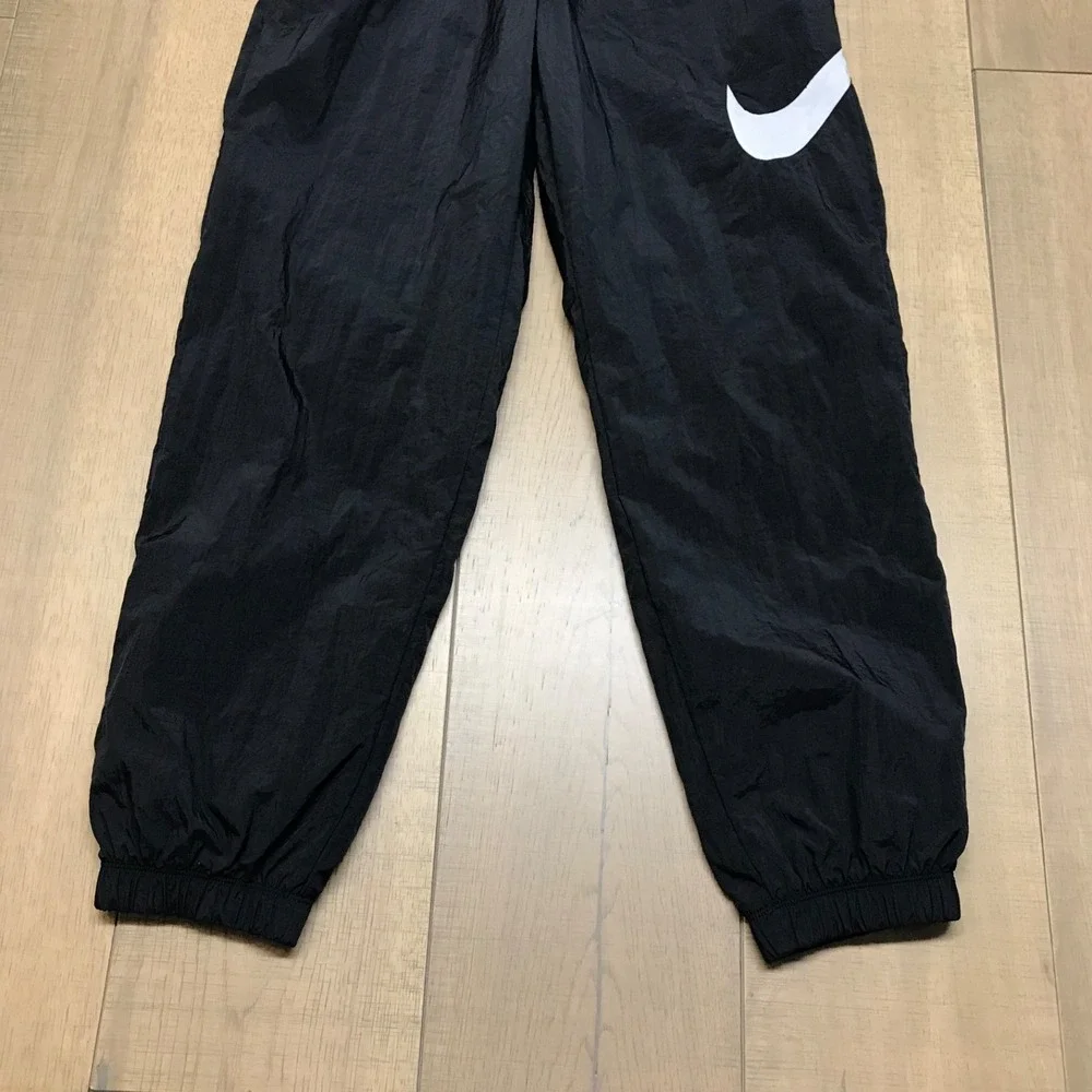 Nike Pants Womens Size S Black Loose Fit Nylon Mesh Lined Sportswear‎